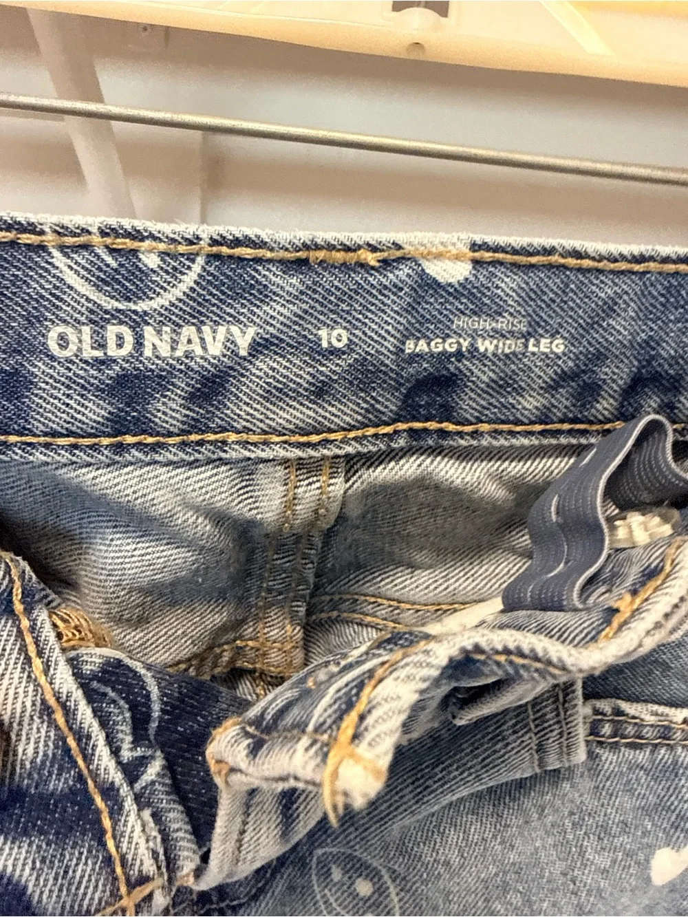 Girls Old Navy baggy wide leg jeans with white smile & heart print